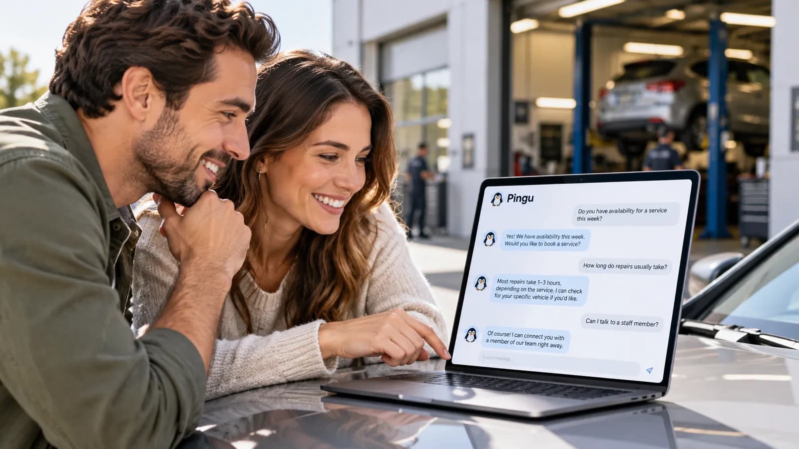 Couple asking the Pingu chatbot about booking a car service on a laptop