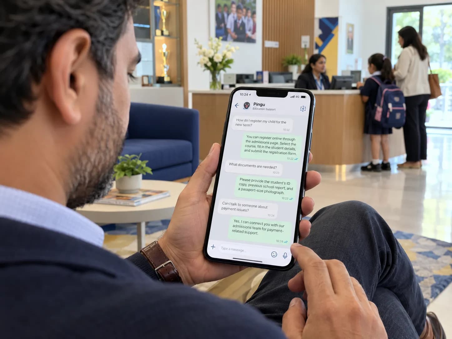 Parent at a school reception asking about admissions with Pingu on a phone