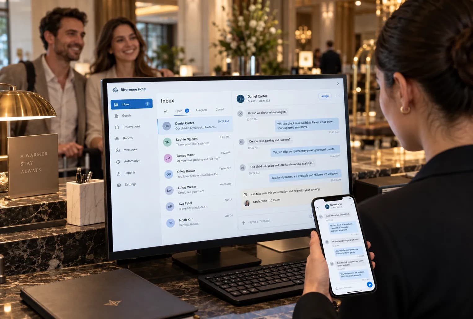 Hotel receptionist managing guest conversations in the Pingu inbox and mobile app at the front desk